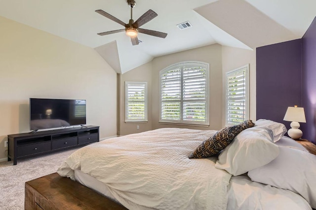 bedroom with carpet floors, lofted ceiling, and ceiling fan