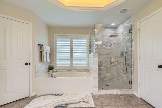 bathroom featuring a garden tub, tile patterned flooring, and a stall shower