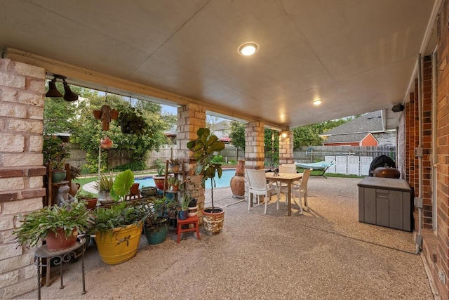 view of patio featuring outdoor dining area and a fenced backyard