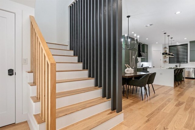 2603 Euclid Ave, Austin, TX 78704 - stairs featuring wood finished floors and recessed lighting