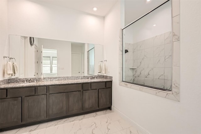 4608 Modena Bay Bnd, Leander, TX 78641 - full bath with marble finish flooring, double vanity, a tile shower, and recessed lighting