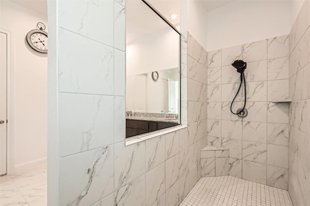 4608 Modena Bay Bnd, Leander, TX 78641 - full bathroom with a tile shower, marble look tile flooring, and vanity