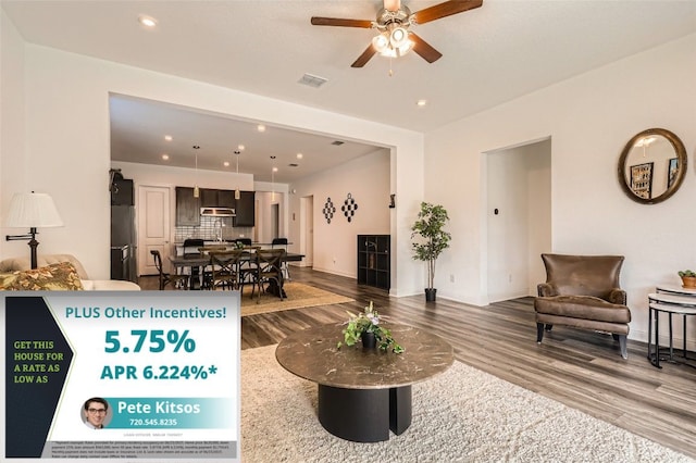 4608 Modena Bay Bnd, Leander, TX 78641 - living area with wood finished floors, a ceiling fan, and recessed lighting