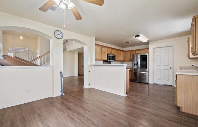 13306 James Monroe St, Manor, TX 78653 - kitchen featuring appliances with stainless steel finishes, light countertops, dark wood finished floors, and open floor plan