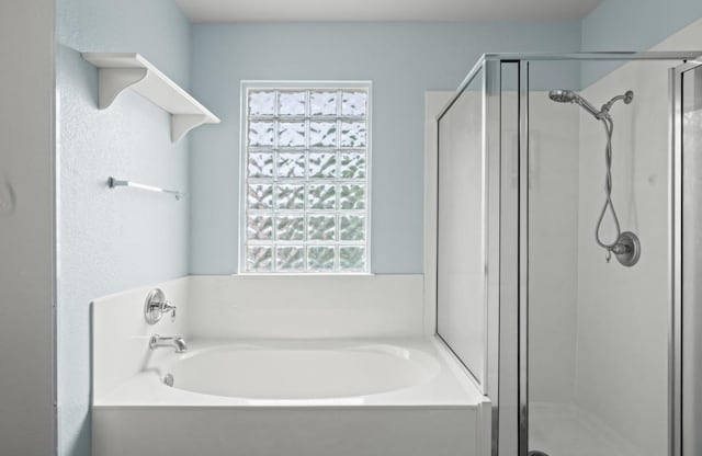 13306 James Monroe St, Manor, TX 78653 - full bathroom featuring a garden tub and a shower stall