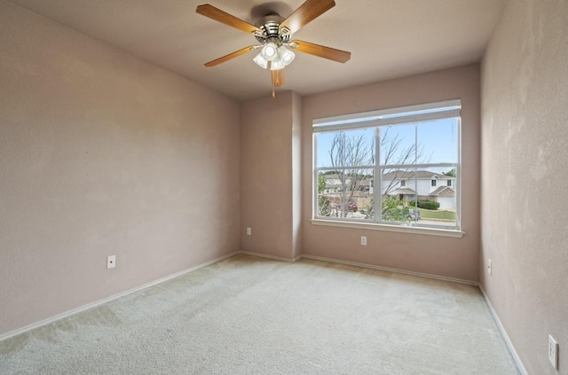 13306 James Monroe St, Manor, TX 78653 - empty room with light carpet, ceiling fan, and baseboards