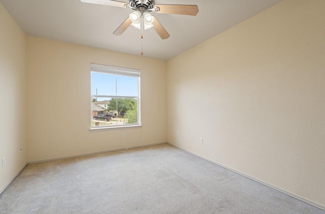 13306 James Monroe St, Manor, TX 78653 - spare room with light carpet, baseboards, and a ceiling fan