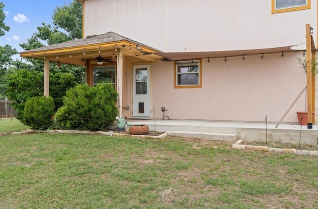 13306 James Monroe St, Manor, TX 78653 - back of house with ceiling fan and a lawn