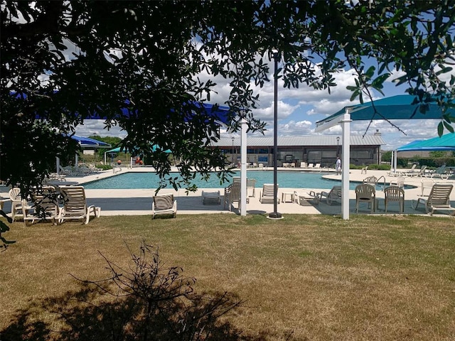286 Spinnaker Loop, Kyle, TX 78640 - community pool with a lawn and a patio area