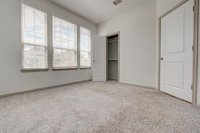 286 Spinnaker Loop, Kyle, TX 78640 - unfurnished bedroom with light carpet, baseboards, and a closet