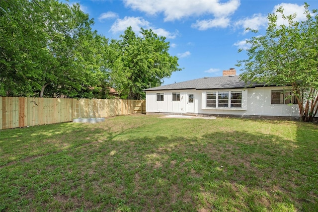 back of property with a chimney