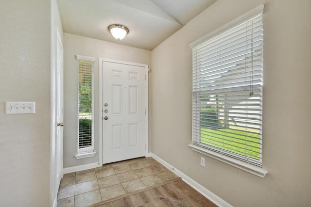 352 Voyager Cv, Kyle, TX 78640 - foyer entrance featuring healthy amount of natural light, baseboards, and lofted ceiling