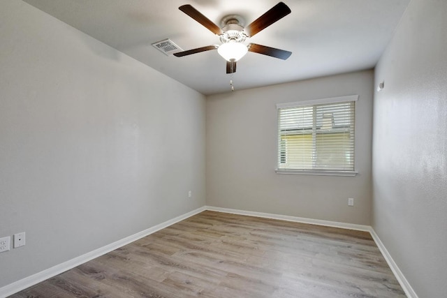 352 Voyager Cv, Kyle, TX 78640 - unfurnished room featuring ceiling fan, wood finished floors, and baseboards