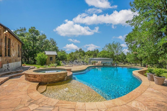 1150 Windmill Run, Wimberley, TX 78676 - view of pool with a storage shed, an outbuilding, a patio area, and a pool with connected hot tub