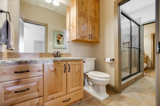 1150 Windmill Run, Wimberley, TX 78676 - bathroom with toilet, a shower stall, and vanity