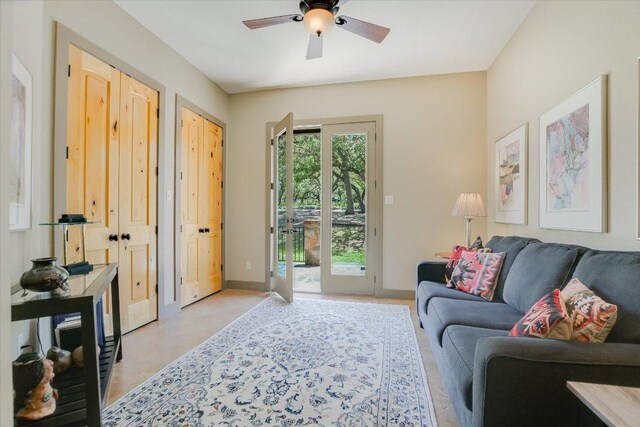 1150 Windmill Run, Wimberley, TX 78676 - living room featuring ceiling fan and baseboards