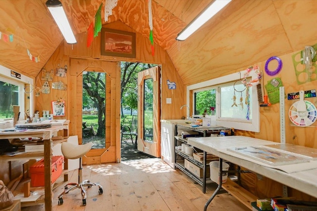 1150 Windmill Run, Wimberley, TX 78676 - interior space featuring lofted ceiling, light wood finished floors, and wooden walls