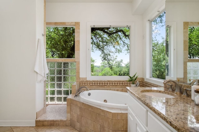 325 Onion Creek Ranch Rd, Driftwood, TX 78619 - bathroom featuring plenty of natural light, a tub with jets, and tile patterned floors
