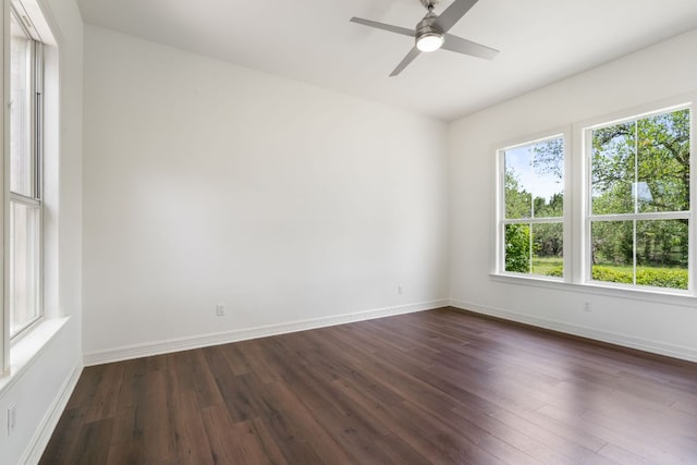 325 Onion Creek Ranch Rd, Driftwood, TX 78619 - spare room with dark wood-style flooring, a ceiling fan, and baseboards