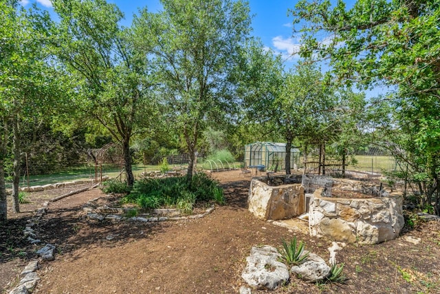 325 Onion Creek Ranch Rd, Driftwood, TX 78619 - view of yard featuring an exterior structure, an outbuilding, and fence