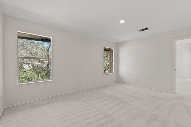 13223 Darwin Ln, Austin, TX 78729 - unfurnished room featuring healthy amount of natural light, light carpet, baseboards, and recessed lighting