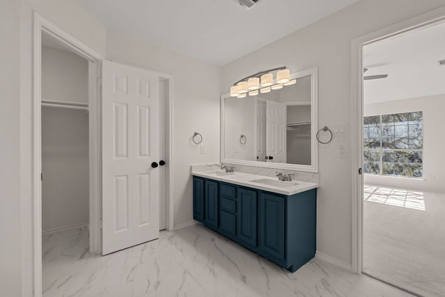 13223 Darwin Ln, Austin, TX 78729 - full bathroom featuring marble finish floors, double vanity, and baseboards