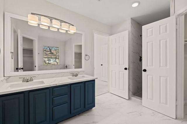 13223 Darwin Ln, Austin, TX 78729 - full bathroom with marble finish floors, double vanity, a marble finish shower, and a spacious closet