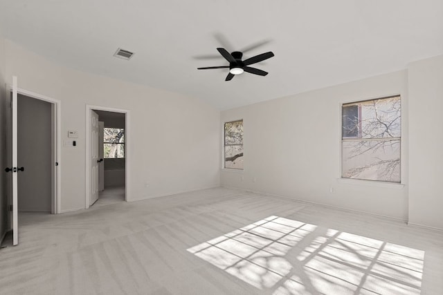 13223 Darwin Ln, Austin, TX 78729 - spare room with a ceiling fan, light carpet, baseboards, and lofted ceiling