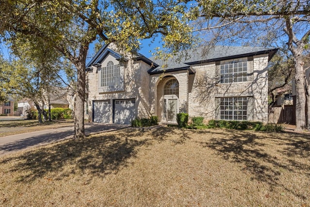 13223 Darwin Ln, Austin, TX 78729 - traditional home featuring driveway, a garage, and a front lawn