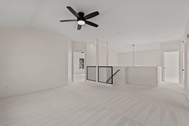 13223 Darwin Ln, Austin, TX 78729 - unfurnished room with vaulted ceiling, light colored carpet, and a ceiling fan