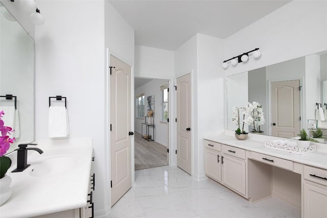 full bathroom featuring marble look tiles and vanity