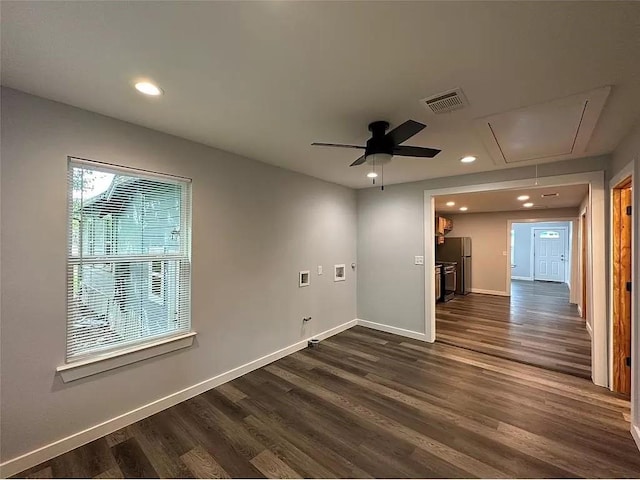 202 Prima St Unit A, Smithville, TX 78957 - unfurnished room featuring attic access, baseboards, dark wood-style floors, recessed lighting, and ceiling fan