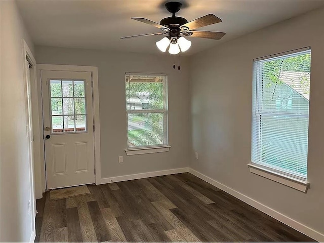 202 Prima St Unit A, Smithville, TX 78957 - doorway to outside featuring plenty of natural light, dark wood-type flooring, baseboards, and ceiling fan