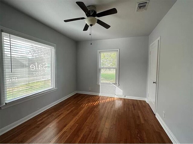 202 Prima St Unit A, Smithville, TX 78957 - unfurnished room with dark wood-style flooring and a ceiling fan