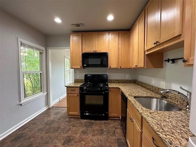 202 Prima St Unit A, Smithville, TX 78957 - kitchen with black appliances, light stone counters, and recessed lighting