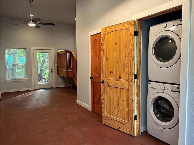 202 Prima St Unit A, Smithville, TX 78957 - washroom with stacked washing machine and dryer, ceiling fan, baseboards, a towering ceiling, and brick floors