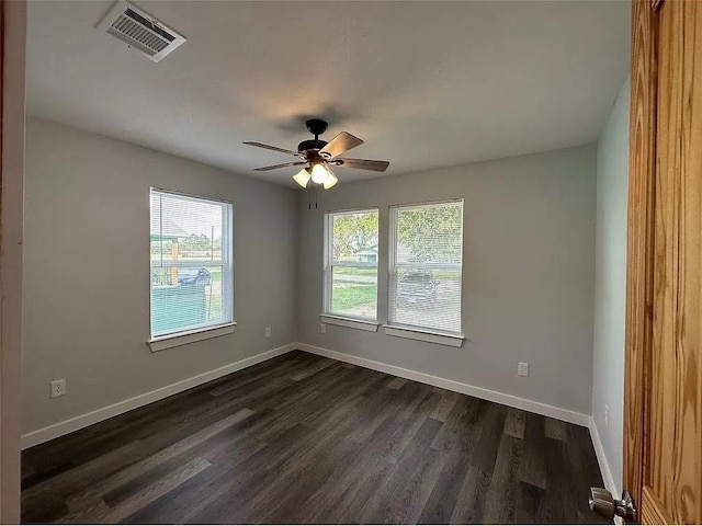 202 Prima St Unit A, Smithville, TX 78957 - spare room featuring dark wood finished floors and ceiling fan