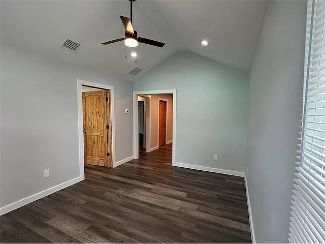 202 Prima St Unit A, Smithville, TX 78957 - unfurnished bedroom featuring baseboards, dark wood finished floors, vaulted ceiling, recessed lighting, and ceiling fan