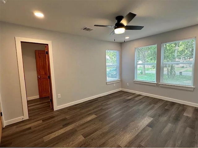 202 Prima St Unit A, Smithville, TX 78957 - unfurnished room featuring dark wood-style floors, ceiling fan, baseboards, and recessed lighting