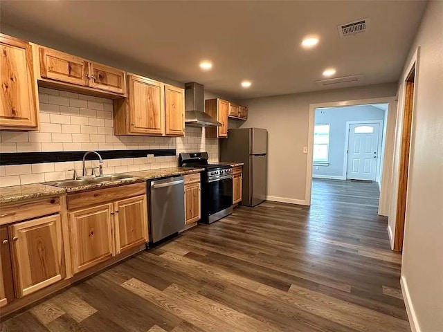 202 Prima St Unit A, Smithville, TX 78957 - kitchen with stainless steel appliances, wall chimney exhaust hood, dark wood-style flooring, tasteful backsplash, and stone countertops