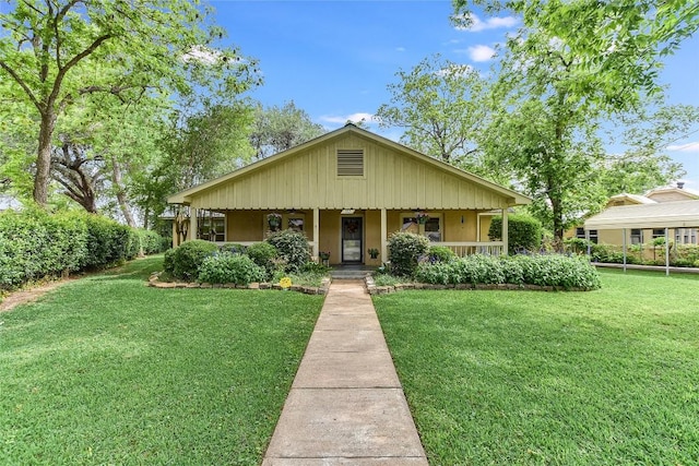 503 Colorado St, Smithville, TX 78957 - bungalow-style house with a front yard, covered porch, and ceiling fan