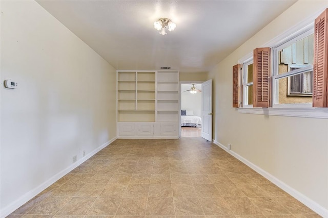 503 Colorado St, Smithville, TX 78957 - empty room with baseboards and a ceiling fan