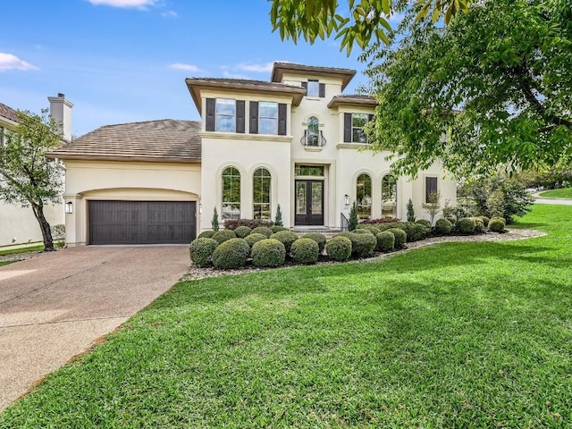 11701 Hunters Green Trl, Austin, TX 78732 - mediterranean / spanish-style house with french doors, stucco siding, a garage, concrete driveway, and a front yard