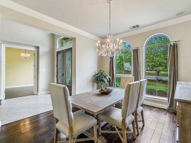 11701 Hunters Green Trl, Austin, TX 78732 - dining space featuring a chandelier, hardwood / wood-style floors, plenty of natural light, crown molding, and baseboards