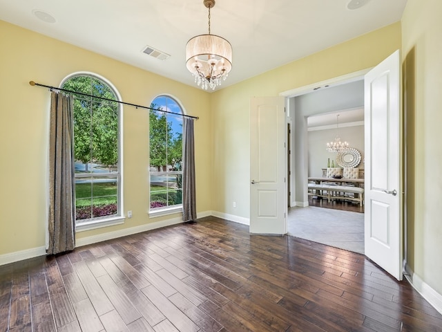 11701 Hunters Green Trl, Austin, TX 78732 - empty room with a chandelier, wood finished floors, and baseboards