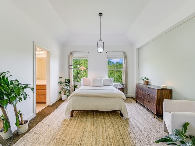 11701 Hunters Green Trl, Austin, TX 78732 - carpeted bedroom featuring lofted ceiling, ensuite bathroom, and baseboards