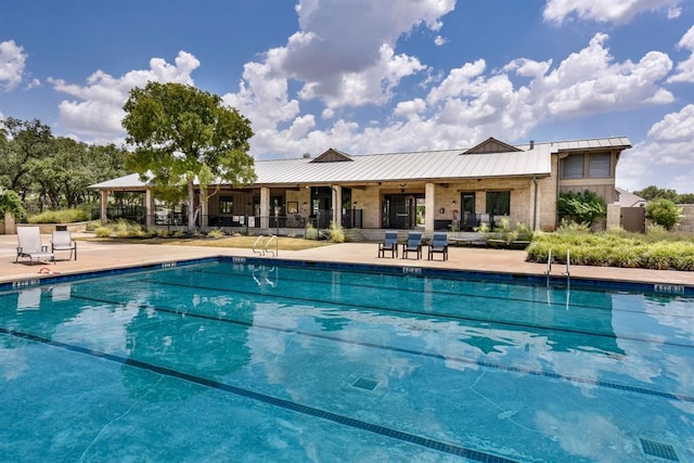 community pool featuring a patio area