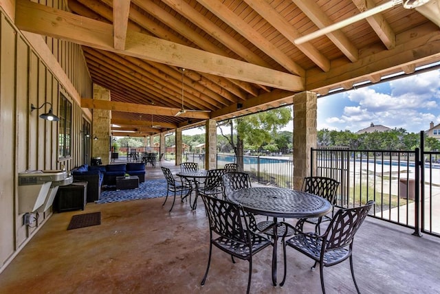 view of patio with fence and outdoor dining space
