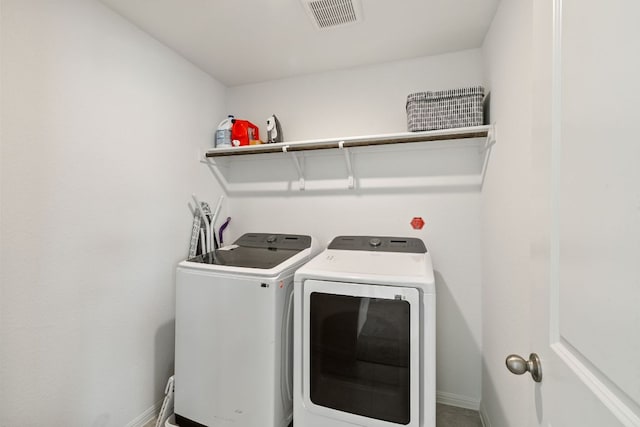 615 Backstays Loop, Kyle, TX 78640 - clothes washing area with washer and clothes dryer and baseboards