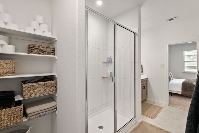 615 Backstays Loop, Kyle, TX 78640 - bathroom featuring a shower stall, ensuite bathroom, tile patterned floors, and vanity